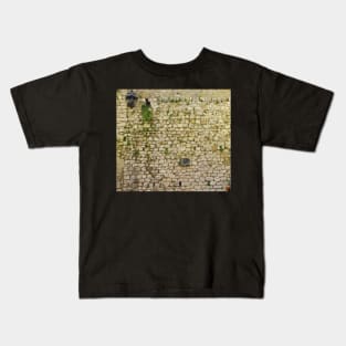 Brick wall in St. Paul de Vence, France Kids T-Shirt